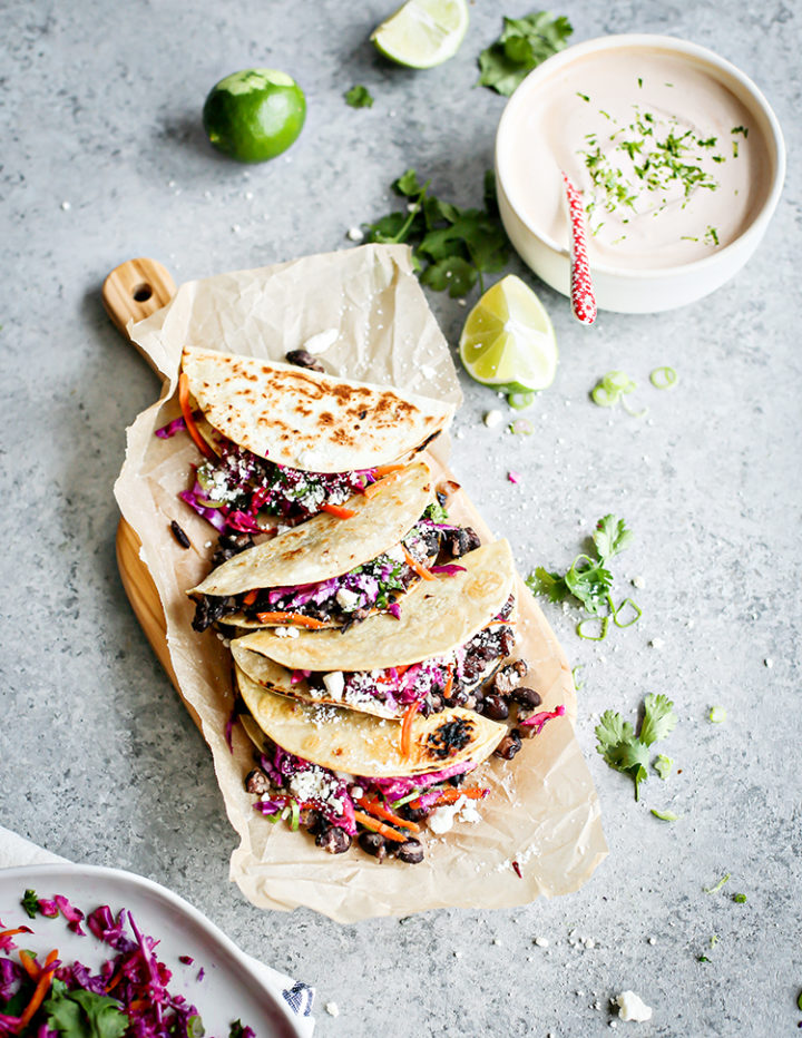 overhead photo of black bean tacos on a cutting board