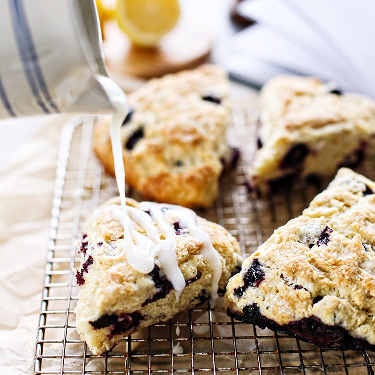 photo of glaze pouring on blueberry lemon scones