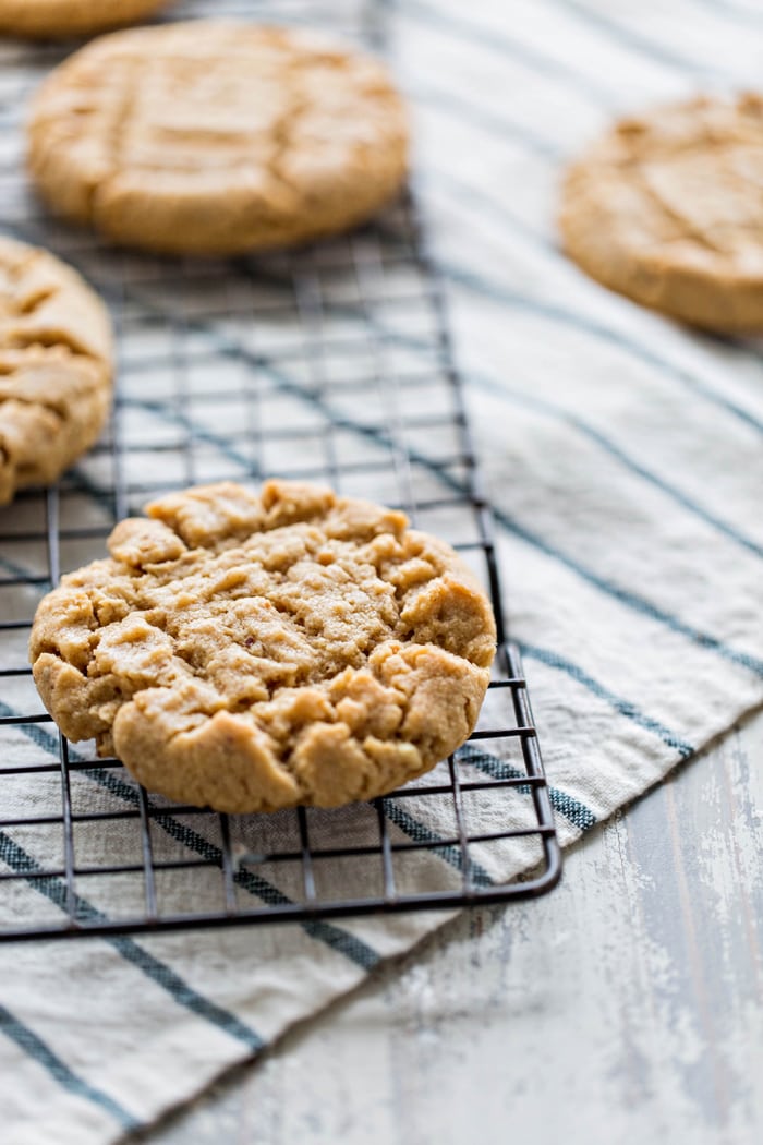 an almond butter cookie cooling on a cooling rack