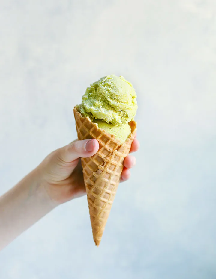 photo of pistachio gelato in an ice cream cone