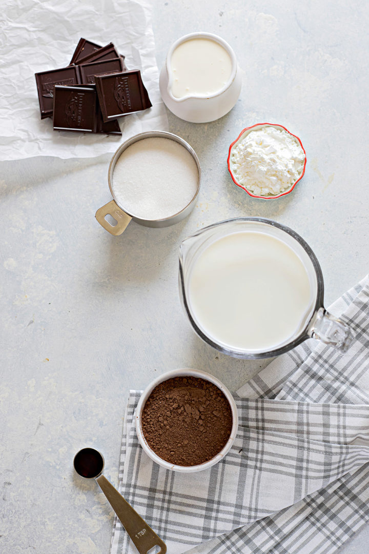 overhead photo of bowls of ingredients needed to make dark chocolate gelato