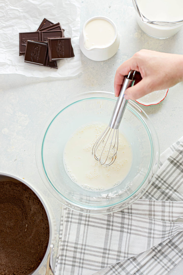 woman whisking ingredients in a bowl
