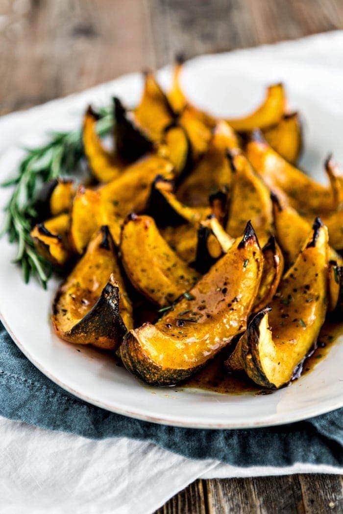 roasted acorn squash on white serving platter