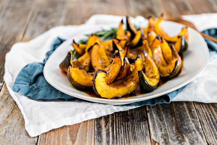 apple cider roasted squash on white platter