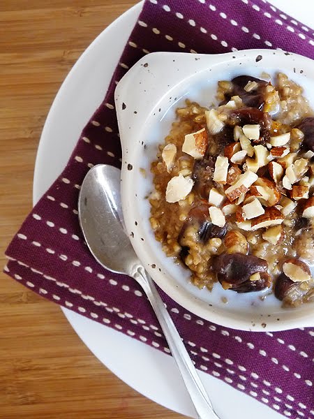 overhead photo of a bowl of tangerine and cherry oatmeal