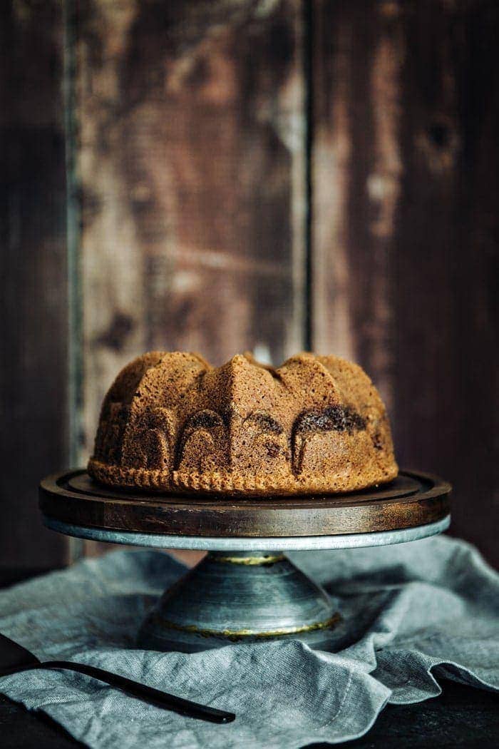 citrus cardamom cake on cake stand