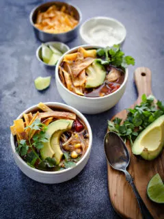 photos of chicken tortilla soup in white bowls