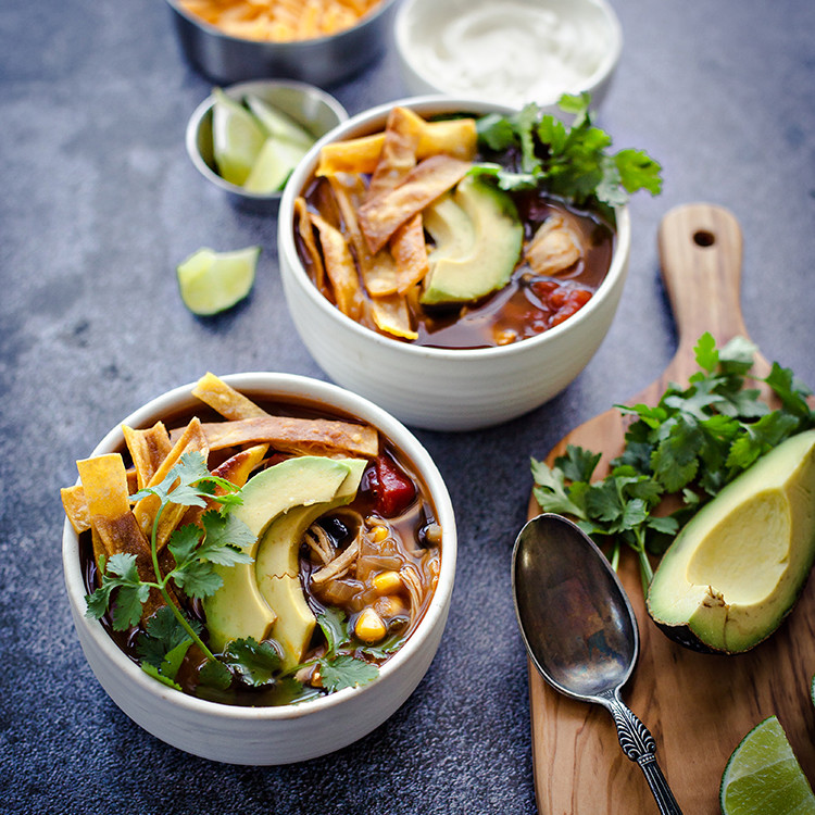 photos of chicken tortilla soup in white bowls