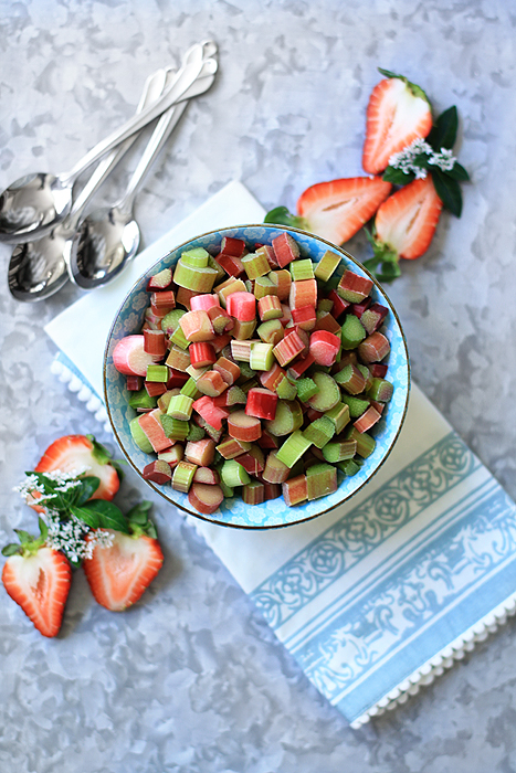 Overhead view of a bowl of chopped fresh rhubarb. 