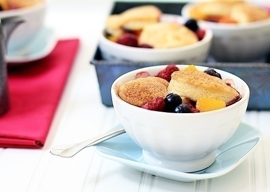 raspberry, blueberry, and peach cobbler with biscuit crust
