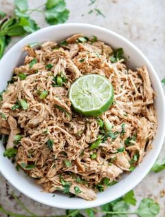 shredded mexican chicken in a white bowl