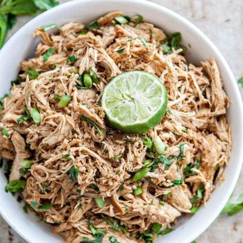 shredded mexican chicken in a white bowl