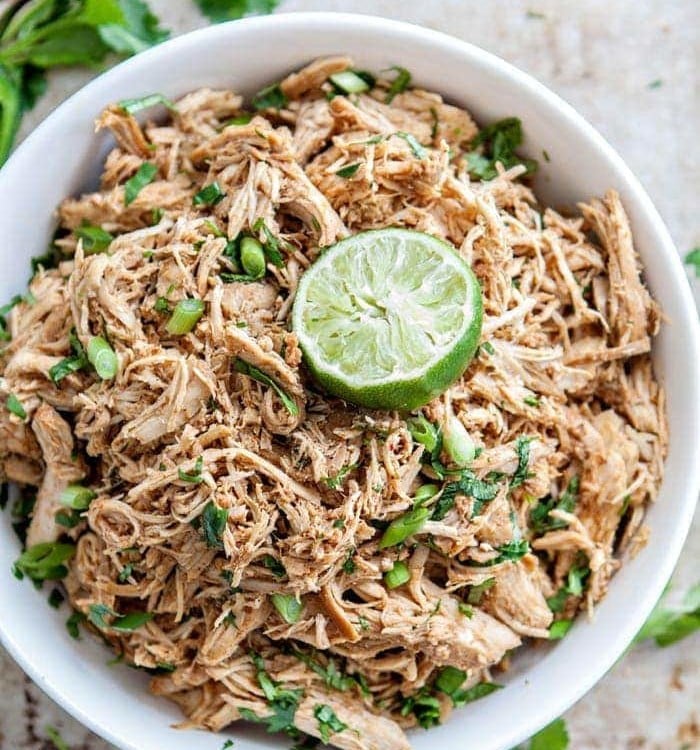 shredded mexican chicken in a white bowl