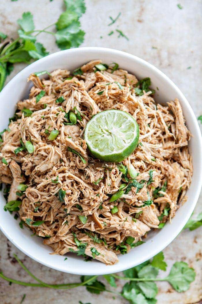 shredded mexican chicken in a white bowl