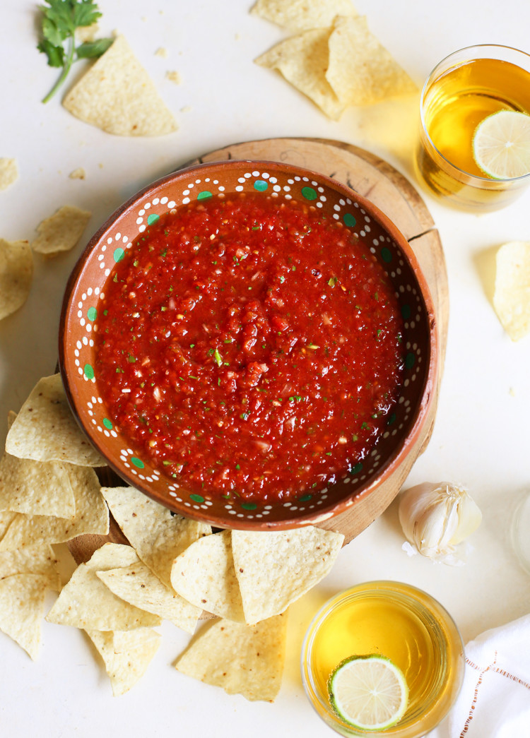 overhead photo of a bowl of salsa restaurant style with chips