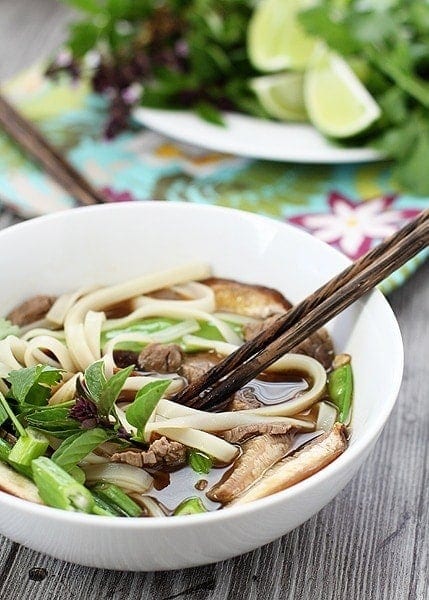 bowl of vietnamese noodle soup with chopsticks
