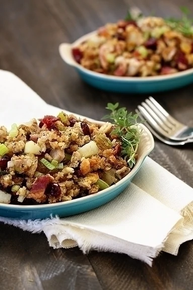 A small blue serving dish of leek and bacon stuffing 