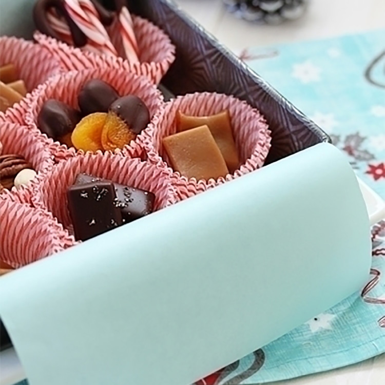 photo of dark chocolate salted caramels and homemade sea salt caramels in a holiday gift box