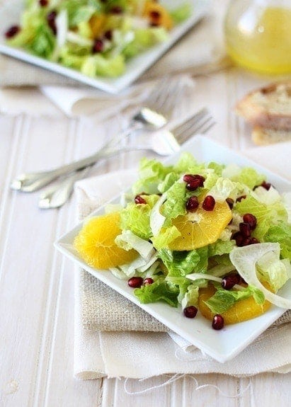 photo of Fennel and Orange Salad with pomegranates on a white plate