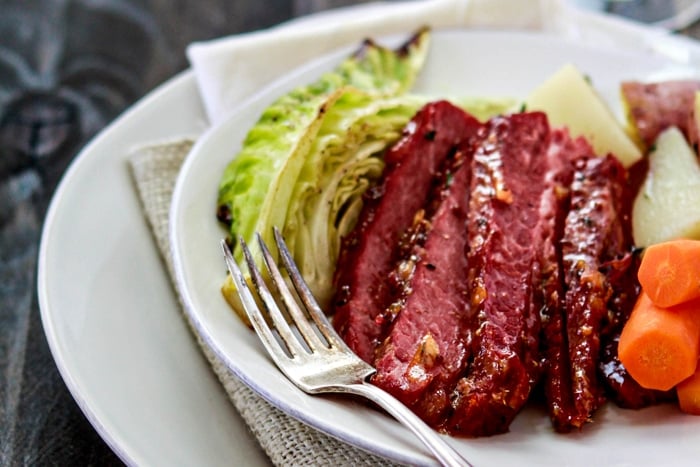 glazed corn beef on white plate with veggies