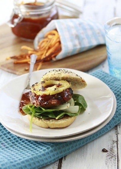 photo of teriyaki turkey burgers on a bun with homemade bbq sauce