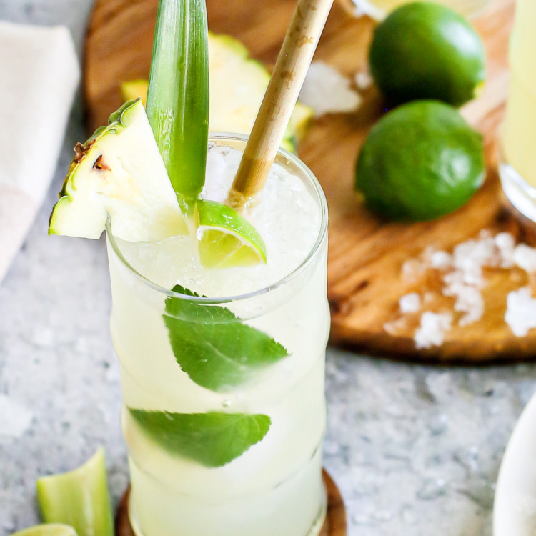 close up photo of a pineapple cooler in a glass