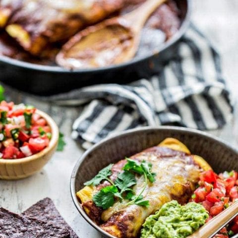 Chicken Enchiladas with Homemade Chile Gravy Enchilada Sauce is a classic Tex-Mex dish from my childhood. Corn tortillas are stuffed with shredded chicken and smothered in a rich, chili gravy sauce before baked up to perfection with a gooey cheese topping.