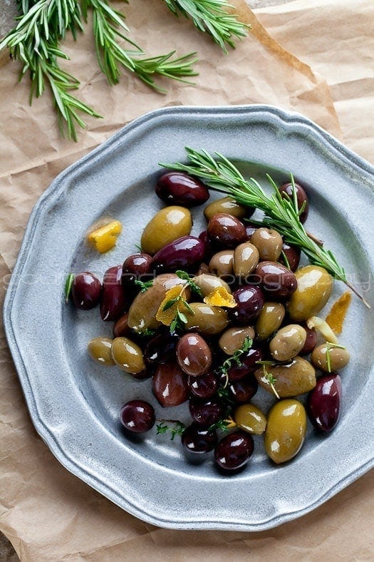 a plate with marinated olives