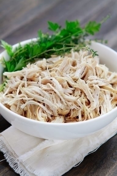 a bowl of crock pot shredded chicken