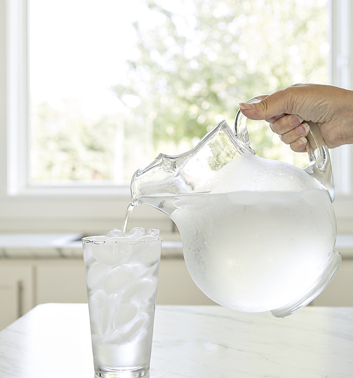 pitcher of water pouring into a glass