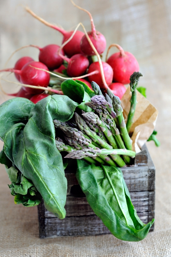 a basket of spring vegetables