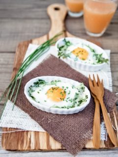 Eggs Baked in White Ramekins with Arugula