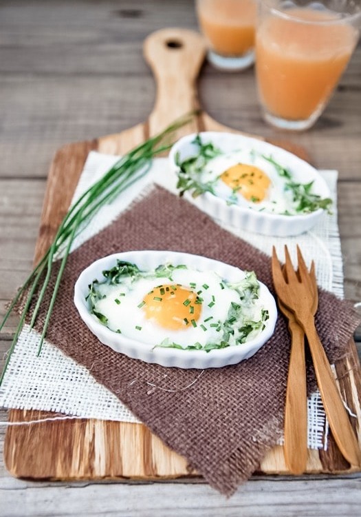 Eggs Baked in White Ramekins with Arugula