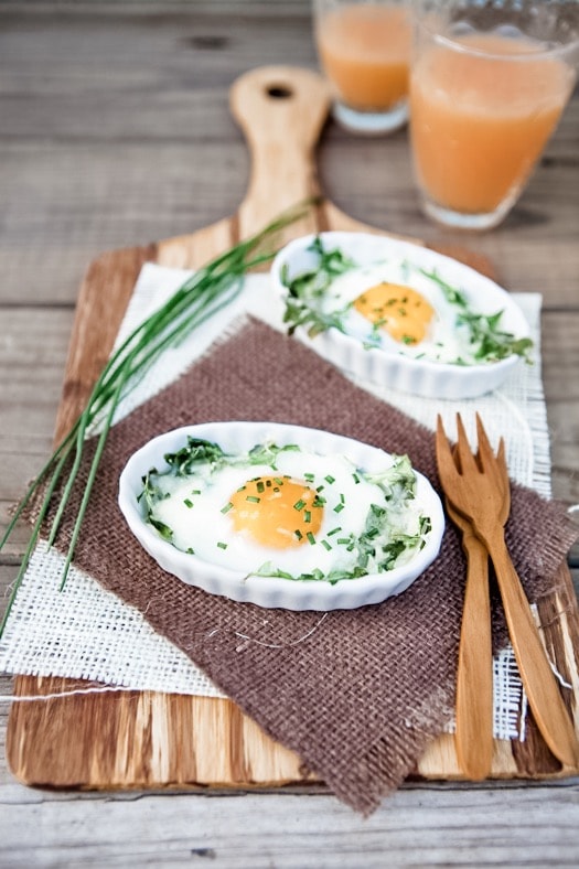 Eggs Baked in White Ramekins with Arugula