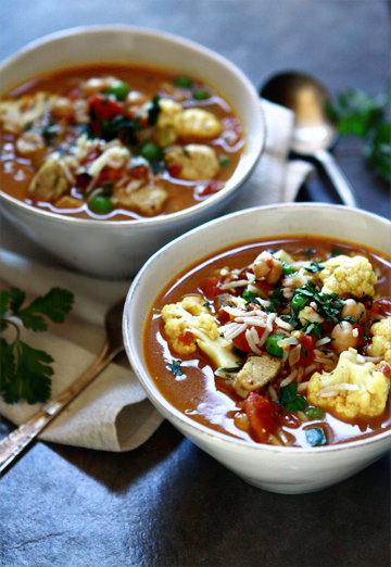 Two white bowls of Coconut Curry Chicken Soup 
