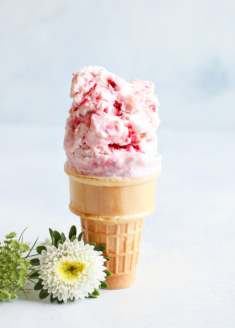 strawberry frozen yogurt on an ice cream cone