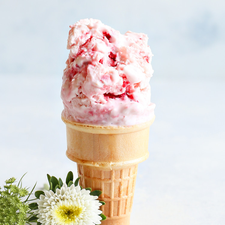 strawberry frozen yogurt on an ice cream cone