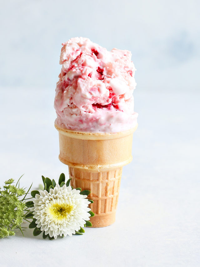strawberry frozen yogurt on an ice cream cone