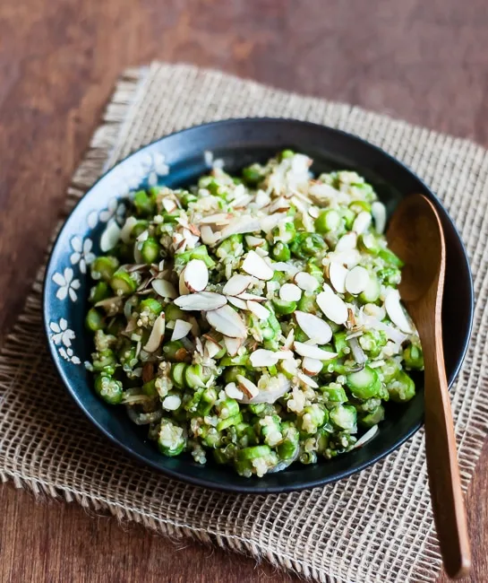 photo of cold asparagus salad in a serving bowl with a spoon