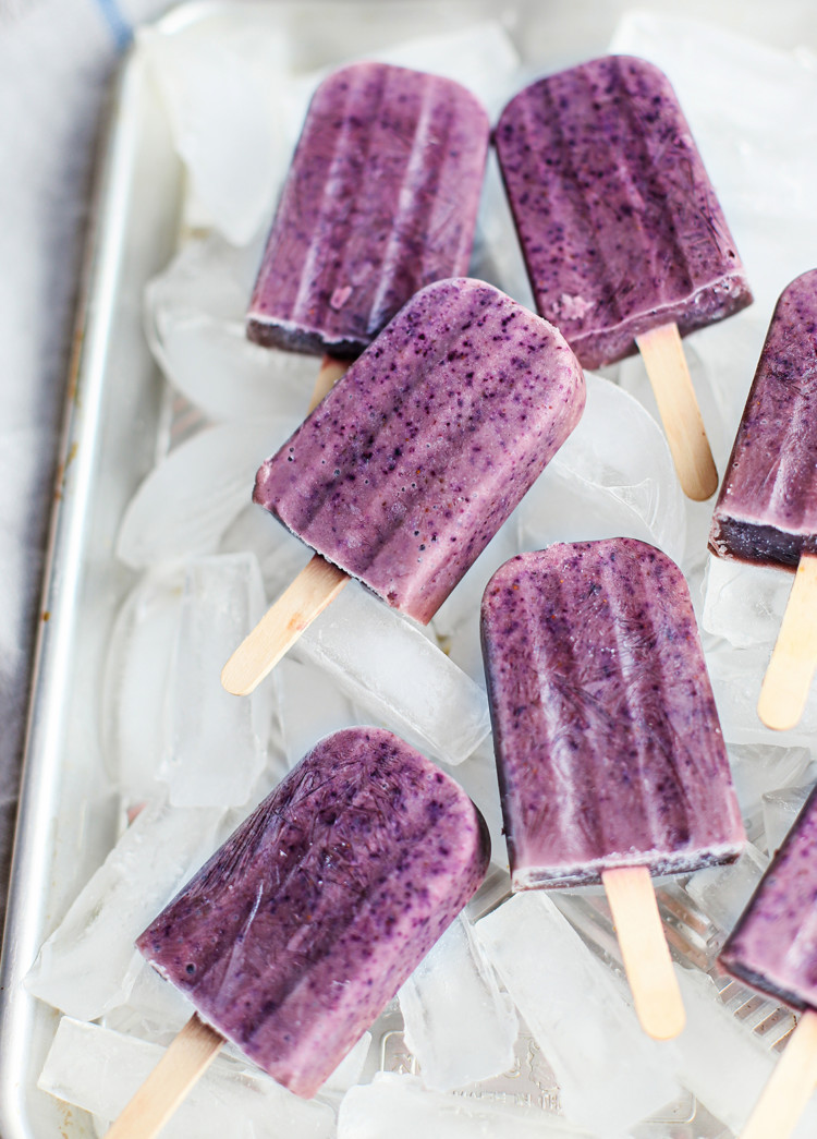 blueberry popsicles in a tray with ice cubes