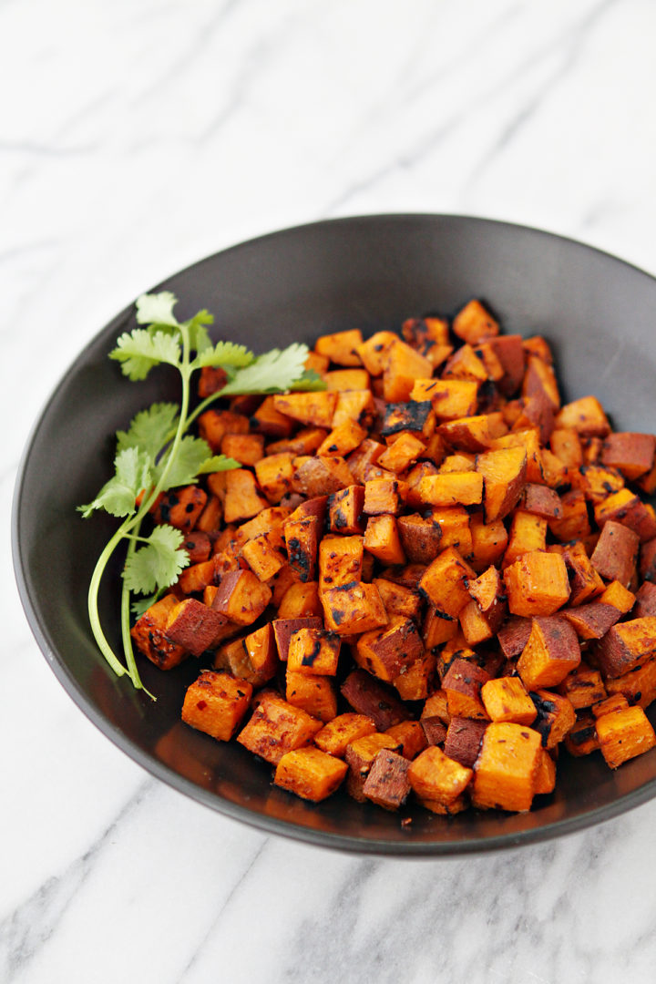photo of grilled sweet potatoes in a black bowl to be used to make vegetarian tacos for taco night