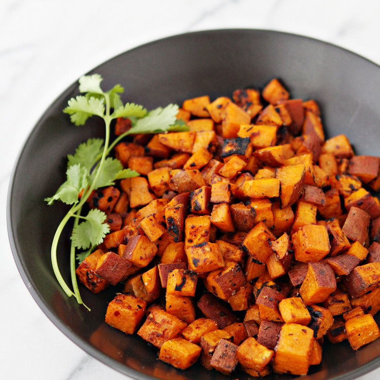 photo of grilled sweet potatoes in a black bowl