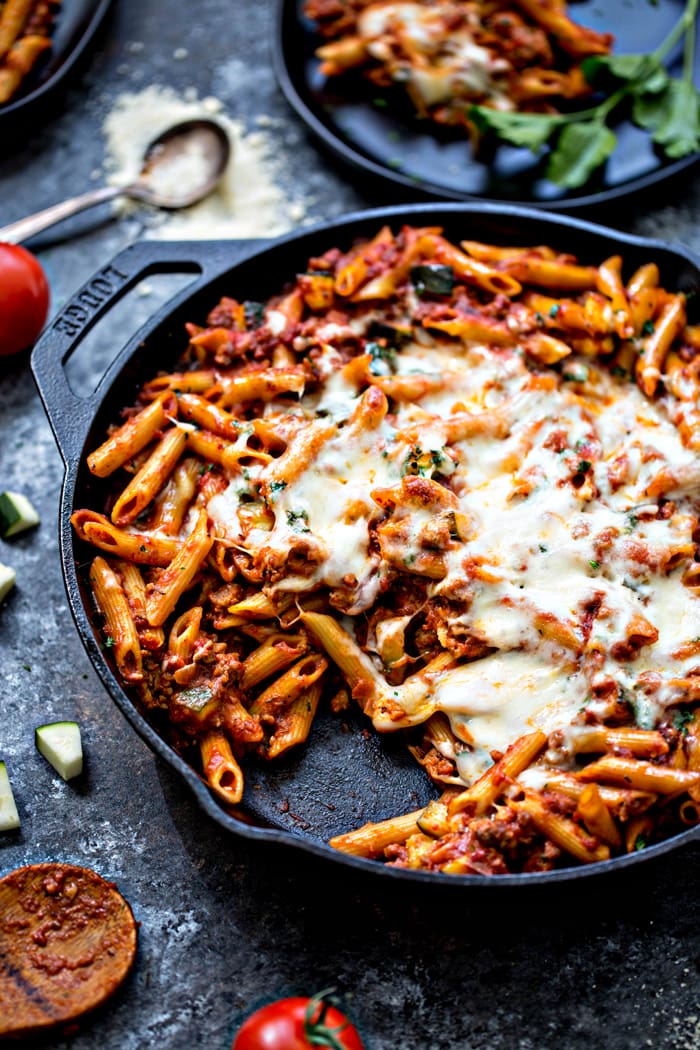 baked ziti with meat sauce in cast iron skillet