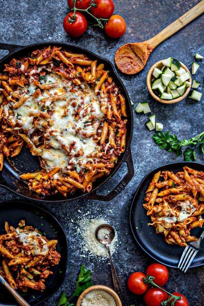 baked ziti with meat sauce in cast iron skillet