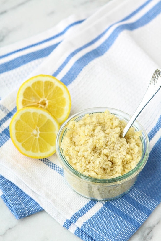 lemon sugar in glass jar on striped tea towel