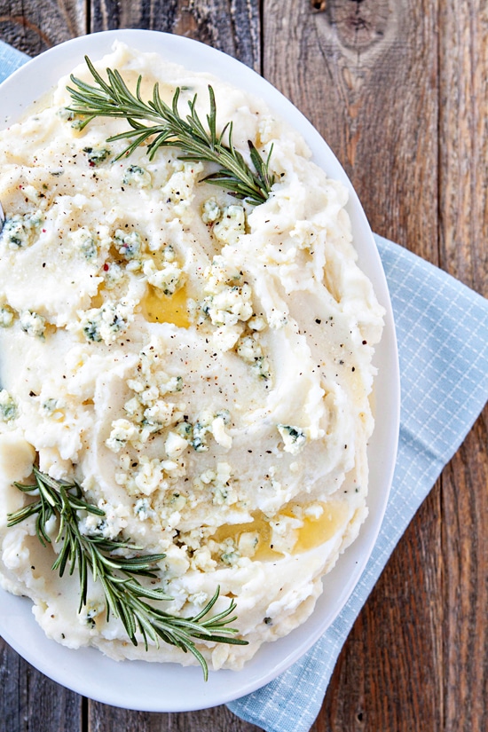 blue cheese rosemary mashed potatoes in white serving dish