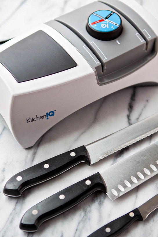 photo of kitchen knives with an electric knife sharpener
