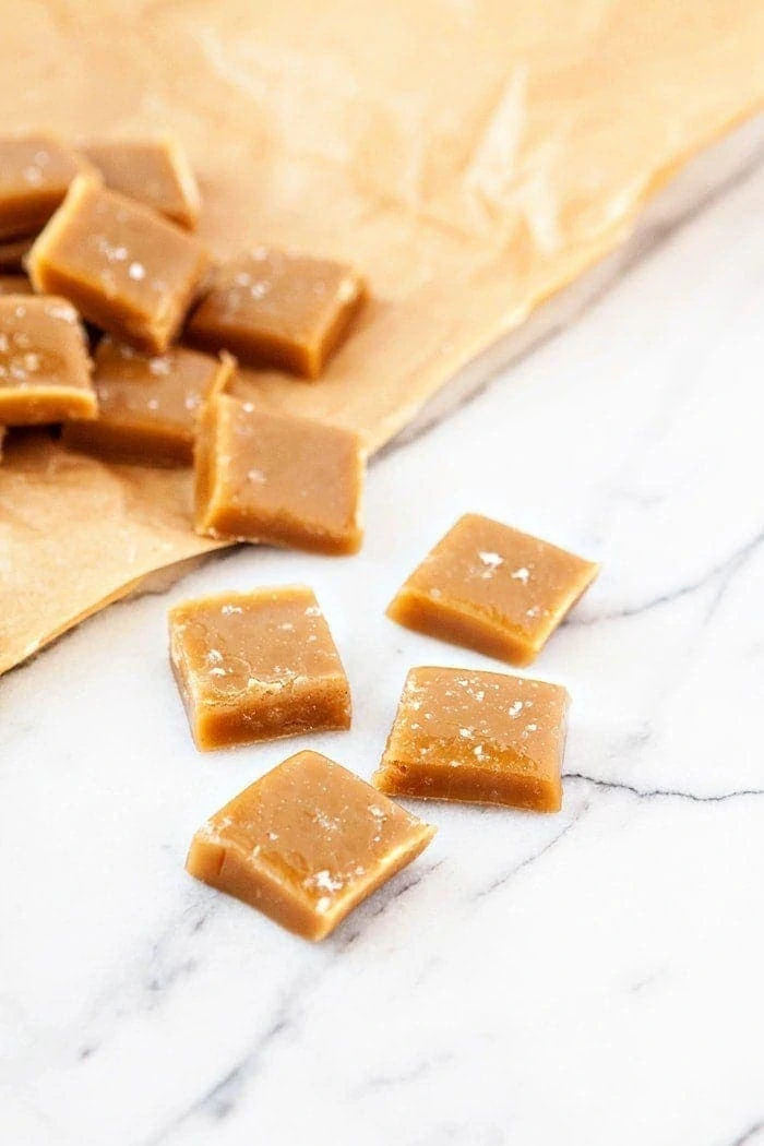Salted bourbon caramels on parchment paper 