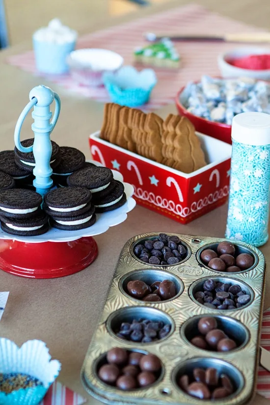 cookie decorating party supplies laid out on table