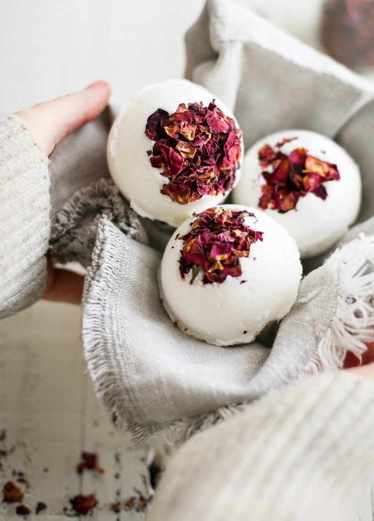 woman holding a basket of diy bath bombs